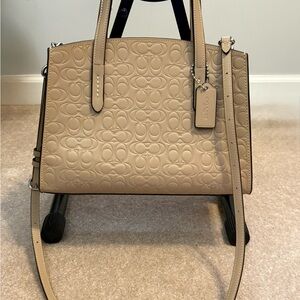 Coach Charlie Carryall 28 Signature Deboss NWOT